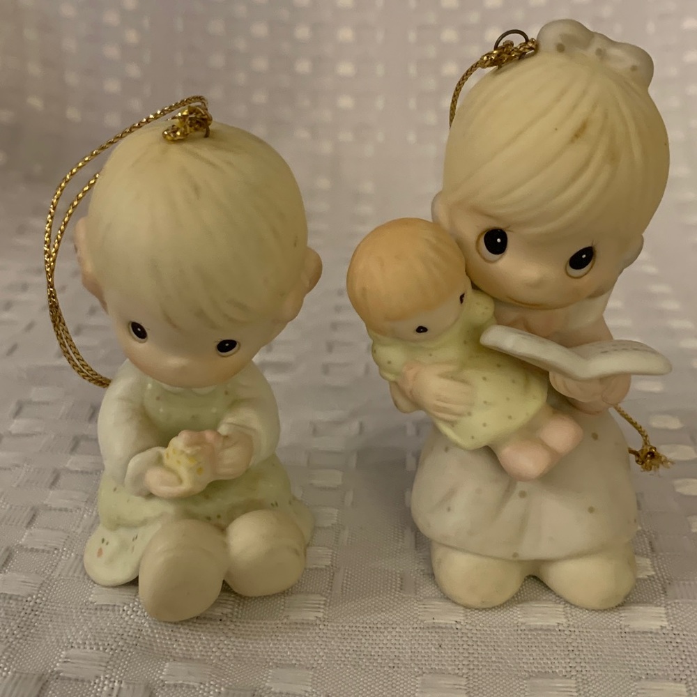 Two Precious Moments Christmas ornaments, 3 inches high.